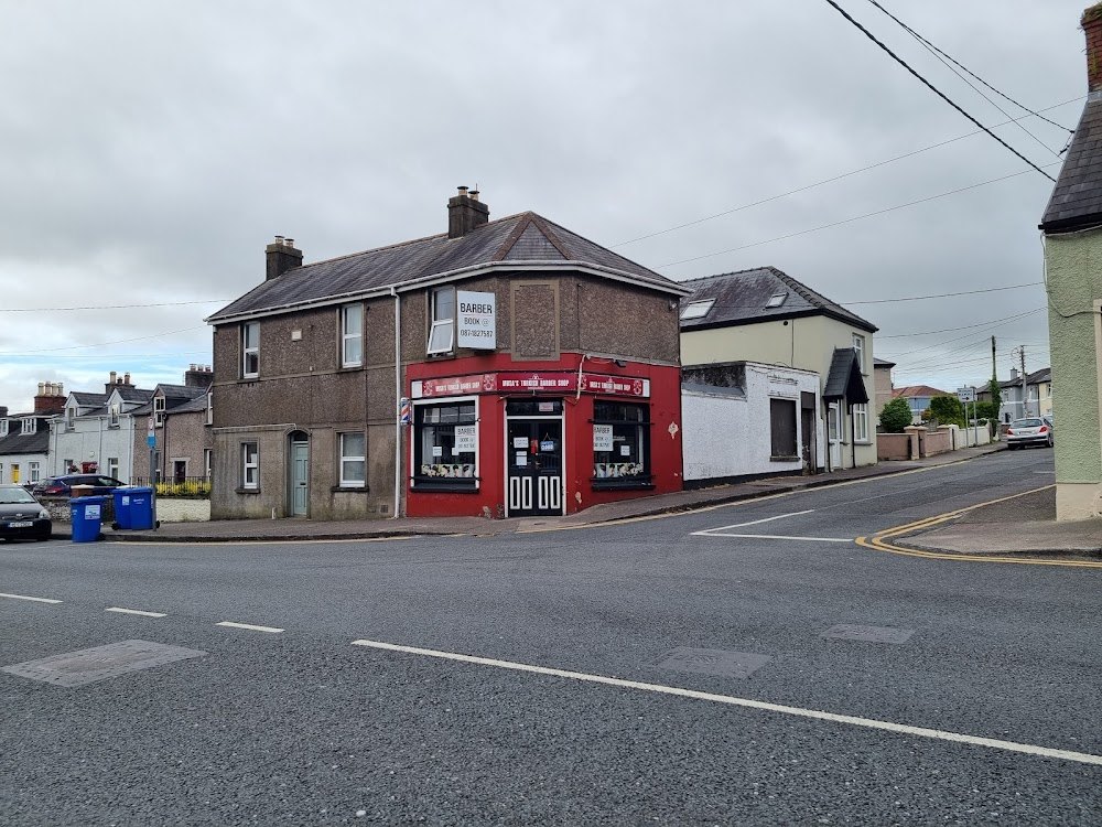 The red corner shopfront of Ballinlough Barbershop at 19 Evergreen Road, Turners Cross, Cork
